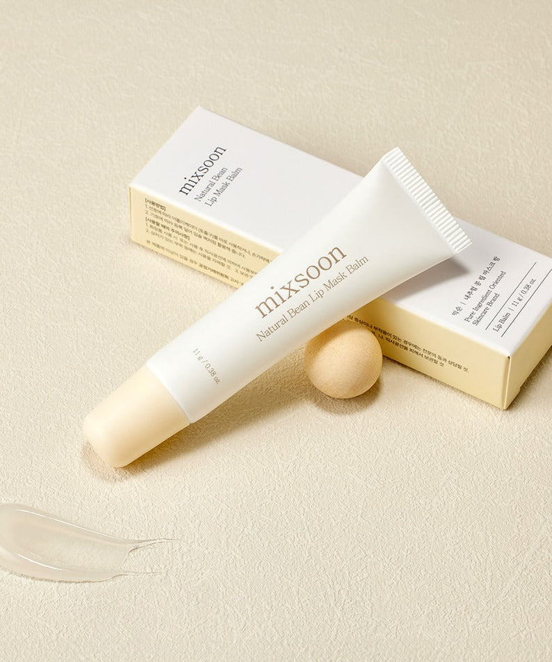 MIXSOON Natural Bean Lip Mask bean tube with packaging and product smear on beige background