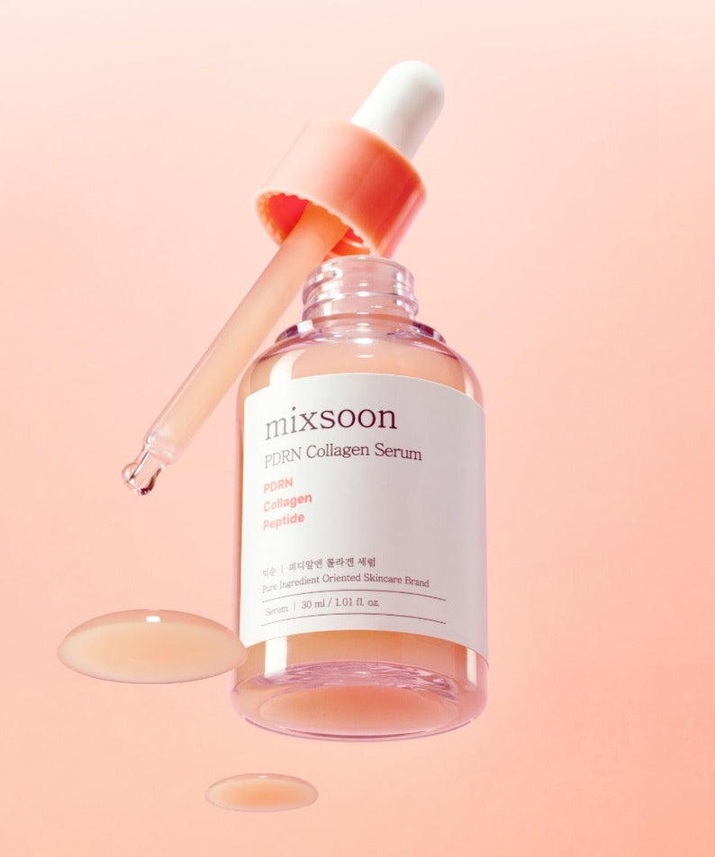 MIXSOON PDRN Collagen Serum 30ml with dropper and serum splashes on a pink background