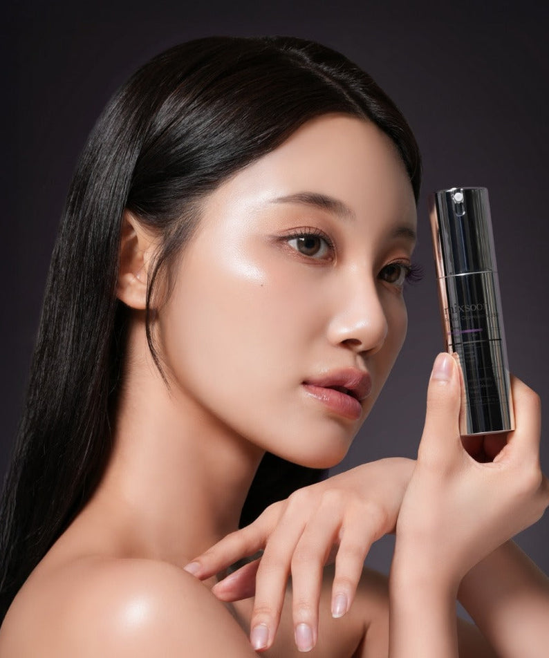 Woman holding MIXSOON Peptide Cica Hyal Shot 350 30ml skincare product