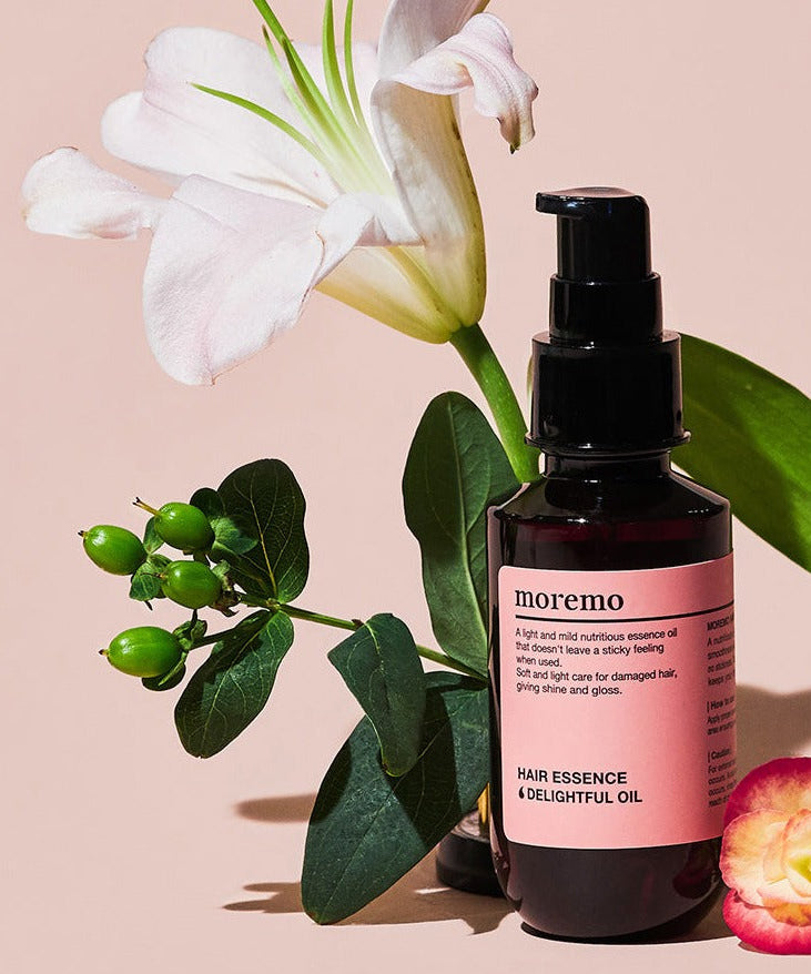 MOREMO Hair Essence Delightful Oil Ampoule with floral design and elegant packaging for nourishing and glossy hair care.