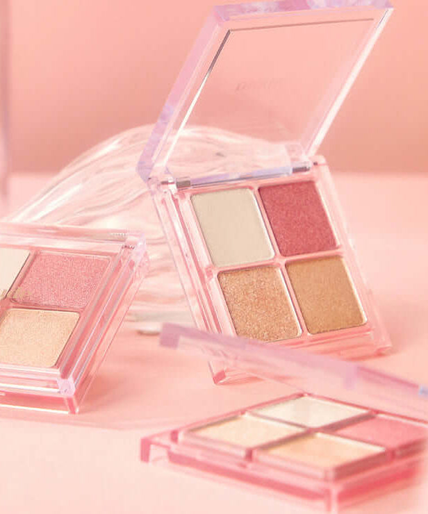 MUDE Full bloom Glow Palette showcasing open palette with pink and gold shades for a radiant glow effect.