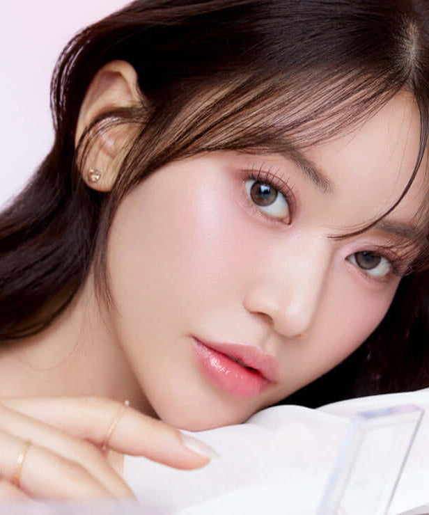 Close-up of a model showcasing makeup from the MUDE Full bloom Glow Palette, highlighting a radiant, glowing complexion.