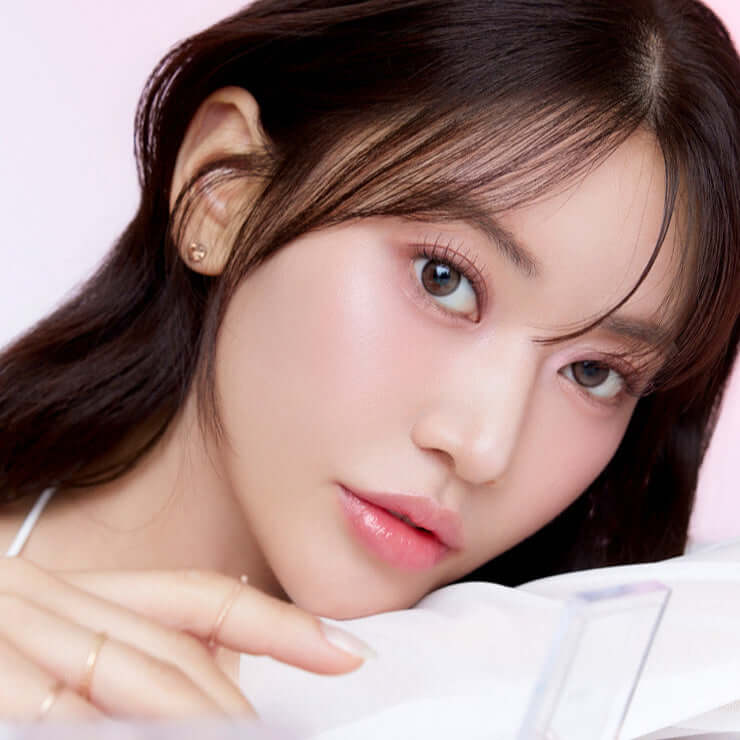Close-up of a model showcasing makeup from the MUDE Full bloom Glow Palette, highlighting a radiant, glowing complexion.