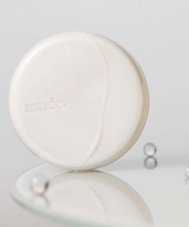 MUDE Soft Silky Fit Cushion in elegant packaging on reflective surface