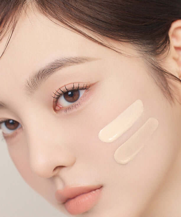 Woman applying MUDE Soft Silky Fit Cushion makeup, highlighting its smooth texture and perfect blend for a flawless complexion.