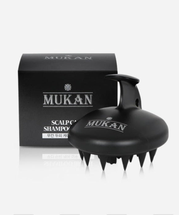 MUKAN Scalp Care Shampoo Brush with packaging, black ergonomic design for enhanced scalp care and massage effectiveness.