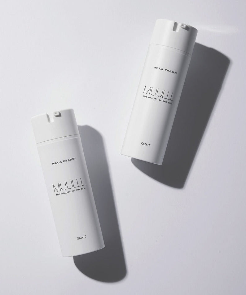 Two bottles of QUA-T Emulsion 150ml placed on a light surface.