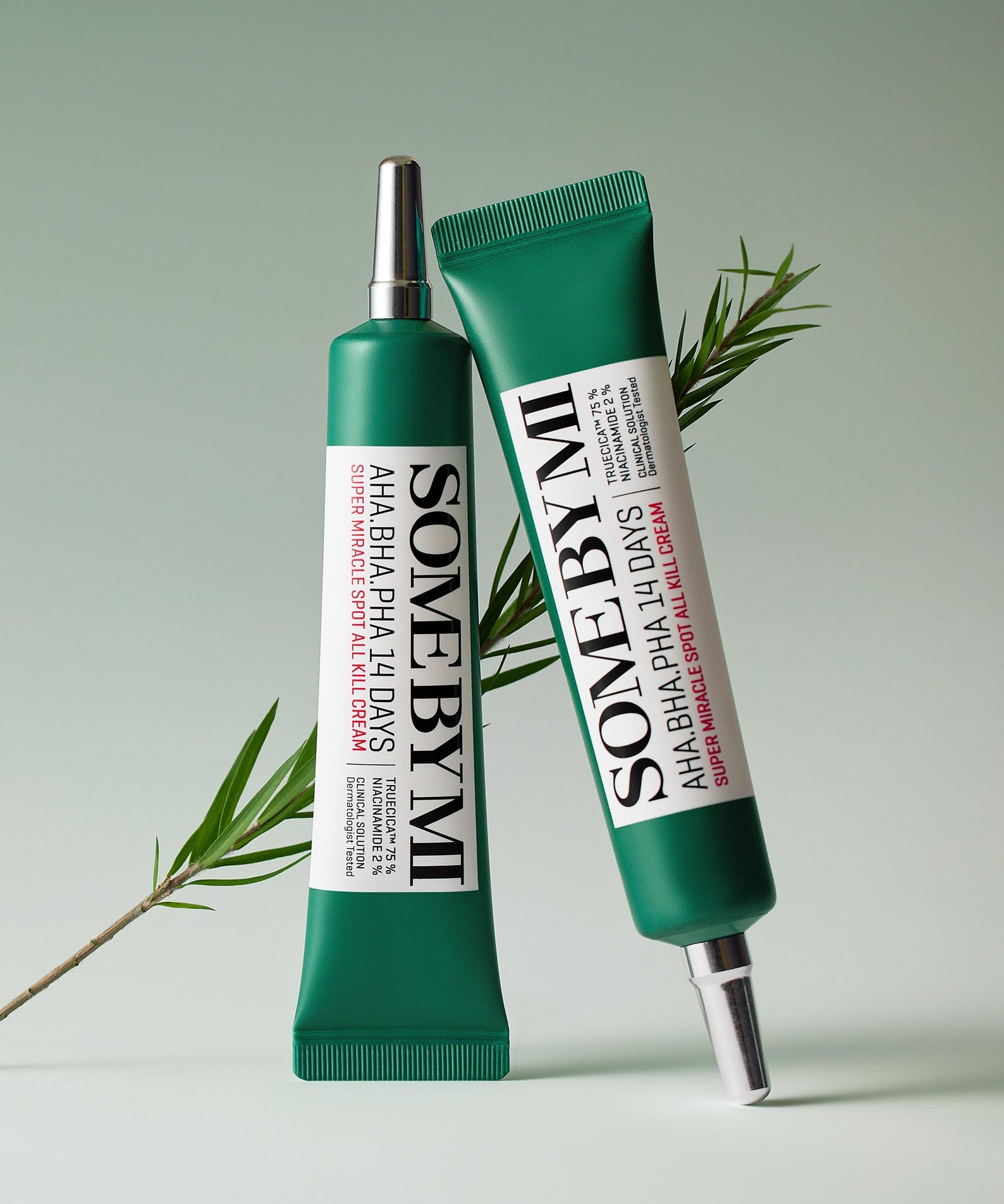 SOME BY MI AHA.BHA.PHA Miracle Spot All Kill Cream 30ml duo tubes with green packaging and plant element in the background.