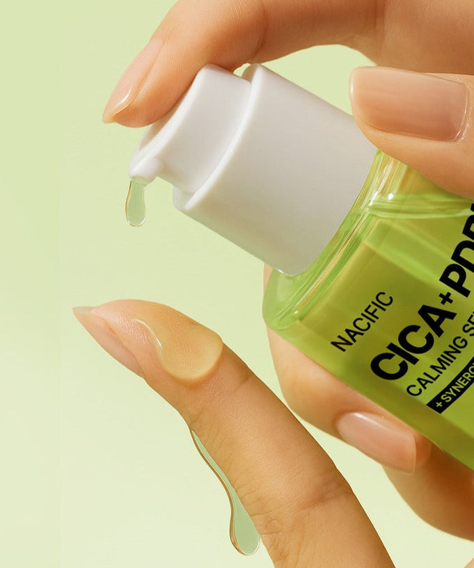 Close-up of NACIFIC Fresh Cica PDRN Calming Serum 50ml being dispensed onto fingers.