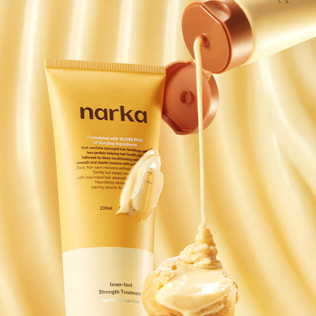 NARKA Innereffect Strength Treatment cream dispensing from tube onto a surface, enhancing hair resilience and shine.