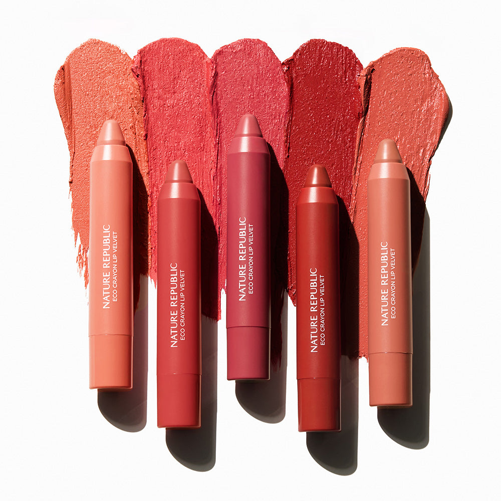 NATURE REPUBLIC By Flower Eco Crayon Lip Velvet in assorted colors displayed on a white background, showcasing vibrant lip color options.