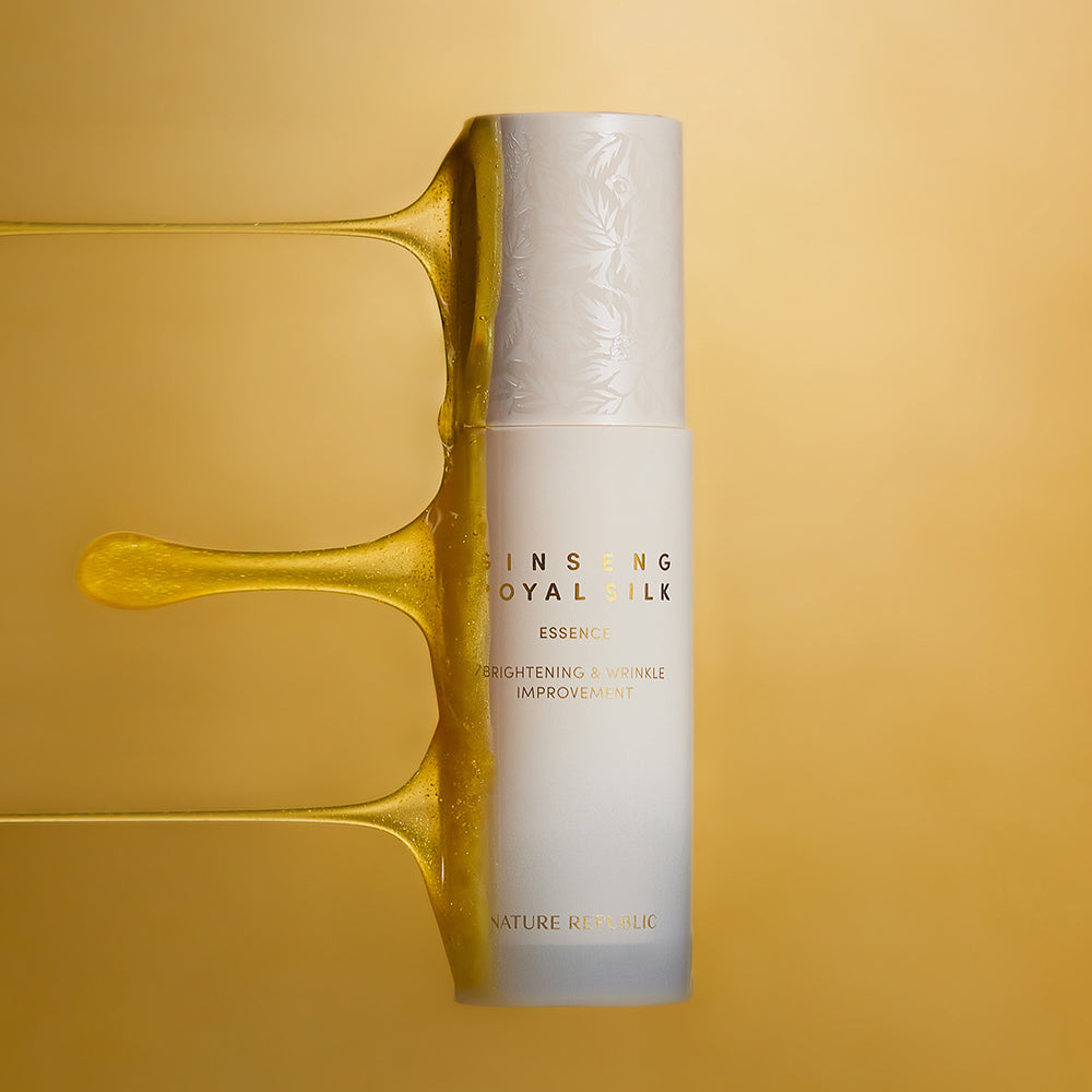NATURE REPUBLIC Ginseng Royal Silk Essence 40ml product bottle with shimmering background