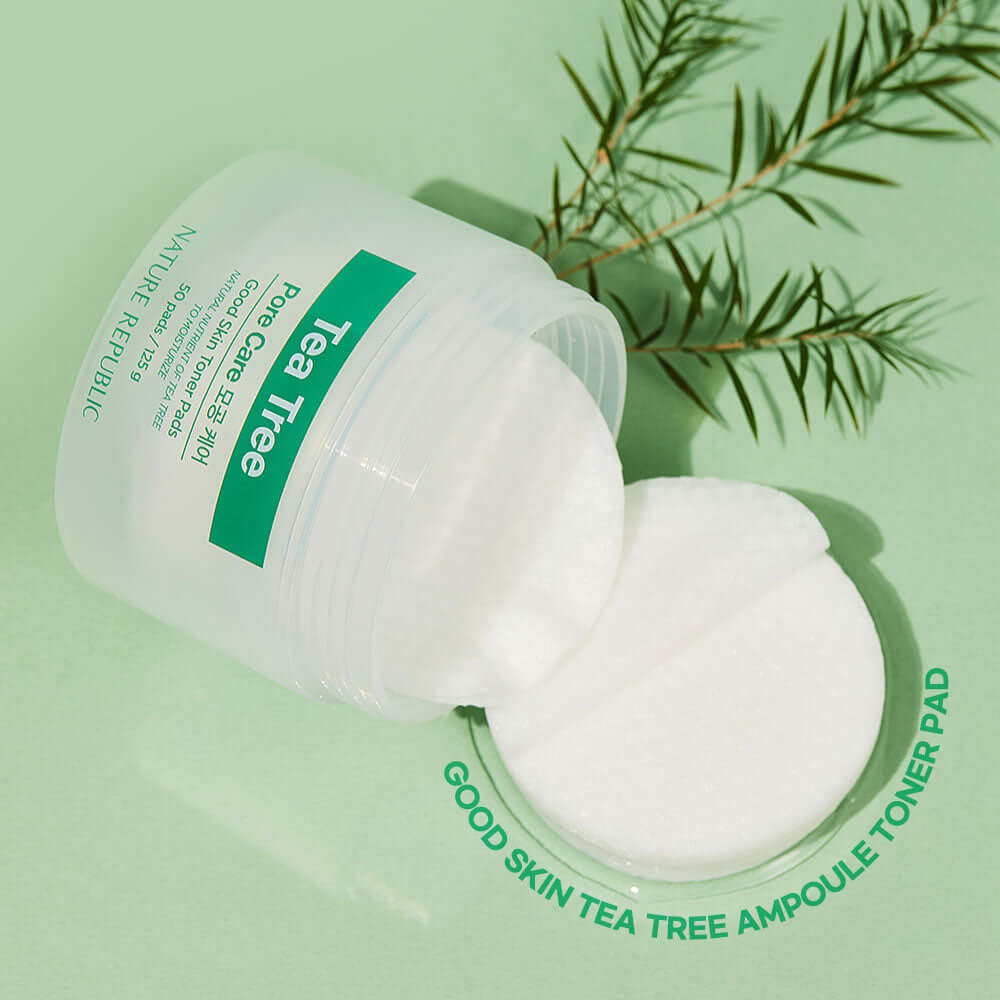 NATURE REPUBLIC Good SKin Tea Tree Ampoule Toner Pads 125g on green background with tea tree leaves