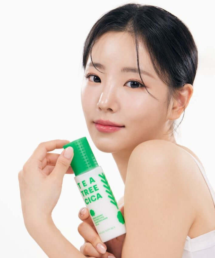 Woman holding NATURE REPUBLIC Green Derma Tea Tree Cica Clear Emulsion 130ml