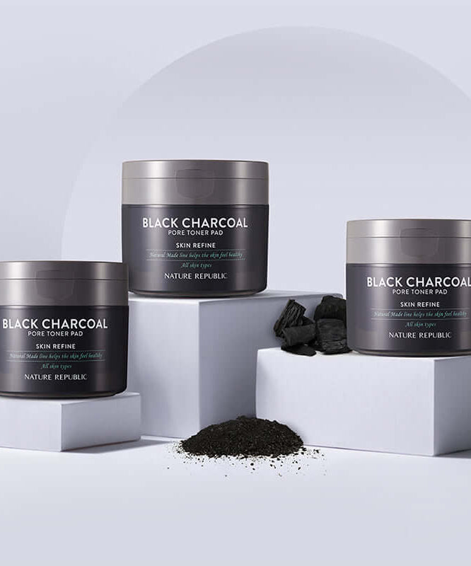NATURE REPUBLIC Made Black Charcoal pore Toner Pads 100g displayed with charcoal pieces and powder
