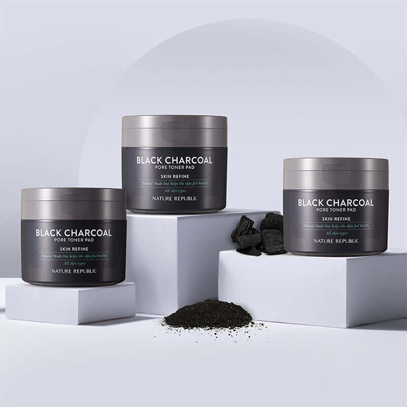 NATURE REPUBLIC Made Black Charcoal pore Toner Pads 100g displayed with charcoal pieces and powder