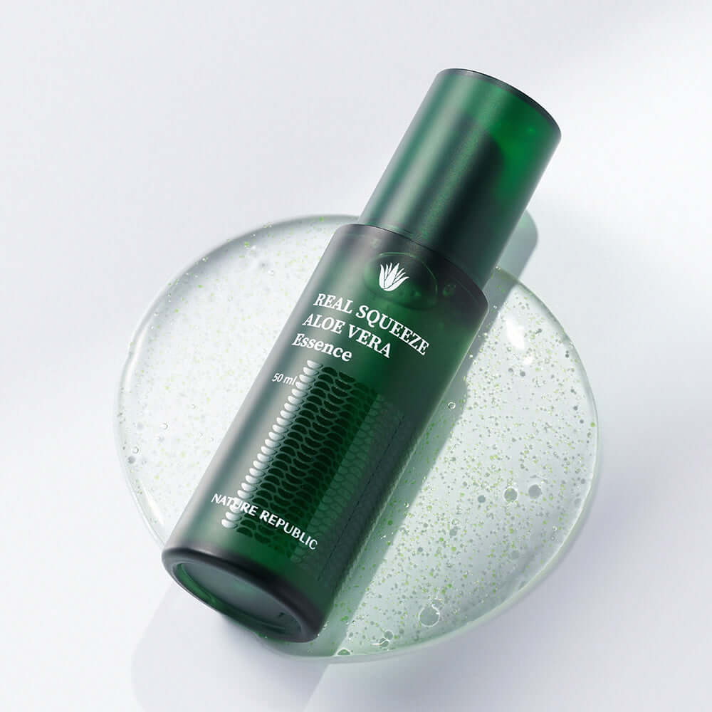 NATURE REPUBLIC Real Squeeze Aloe Vera Emulsion 130ml bottle on a transparent liquid surface