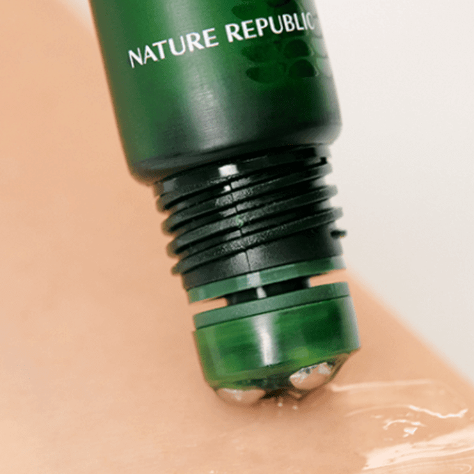NATURE REPUBLIC Real Squeeze Aloe Vera Eye Serum 15ml application close-up with rolling applicator on skin.