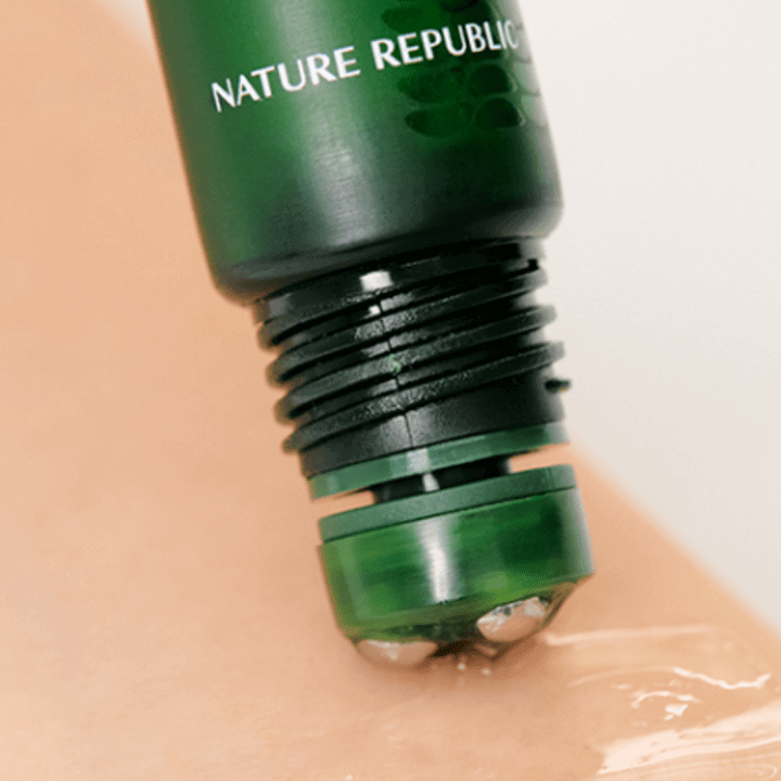 NATURE REPUBLIC Real Squeeze Aloe Vera Eye Serum 15ml application close-up with rolling applicator on skin.