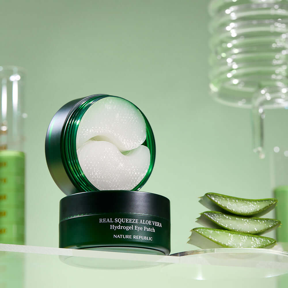 NATURE REPUBLIC Real Sueeze Aloe Vera Hydrogel Eye Patchh 60sheets product on display with aloe vera and green background