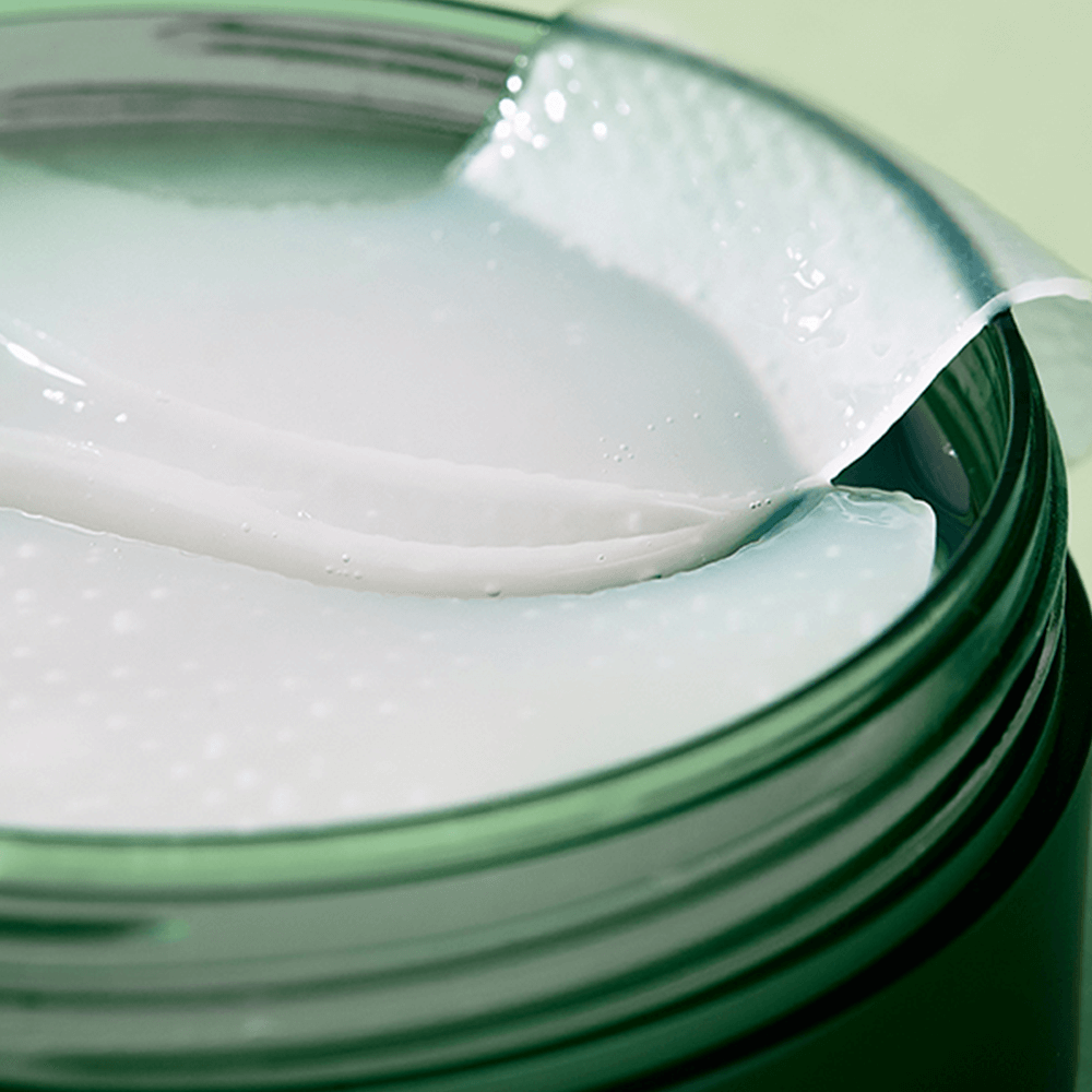 NATURE REPUBLIC Real Sueeze Aloe Vera Hydrogel Eye Patchh 60sheets in a green container, close-up view of the patches.