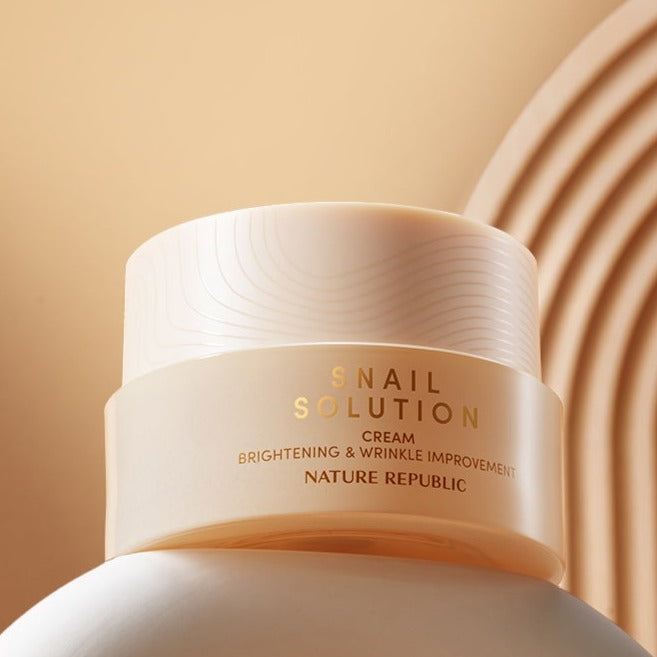 NATURE REPUBLIC Snail Solution Cream 52ml jar on a beige background showcasing the bottle design.