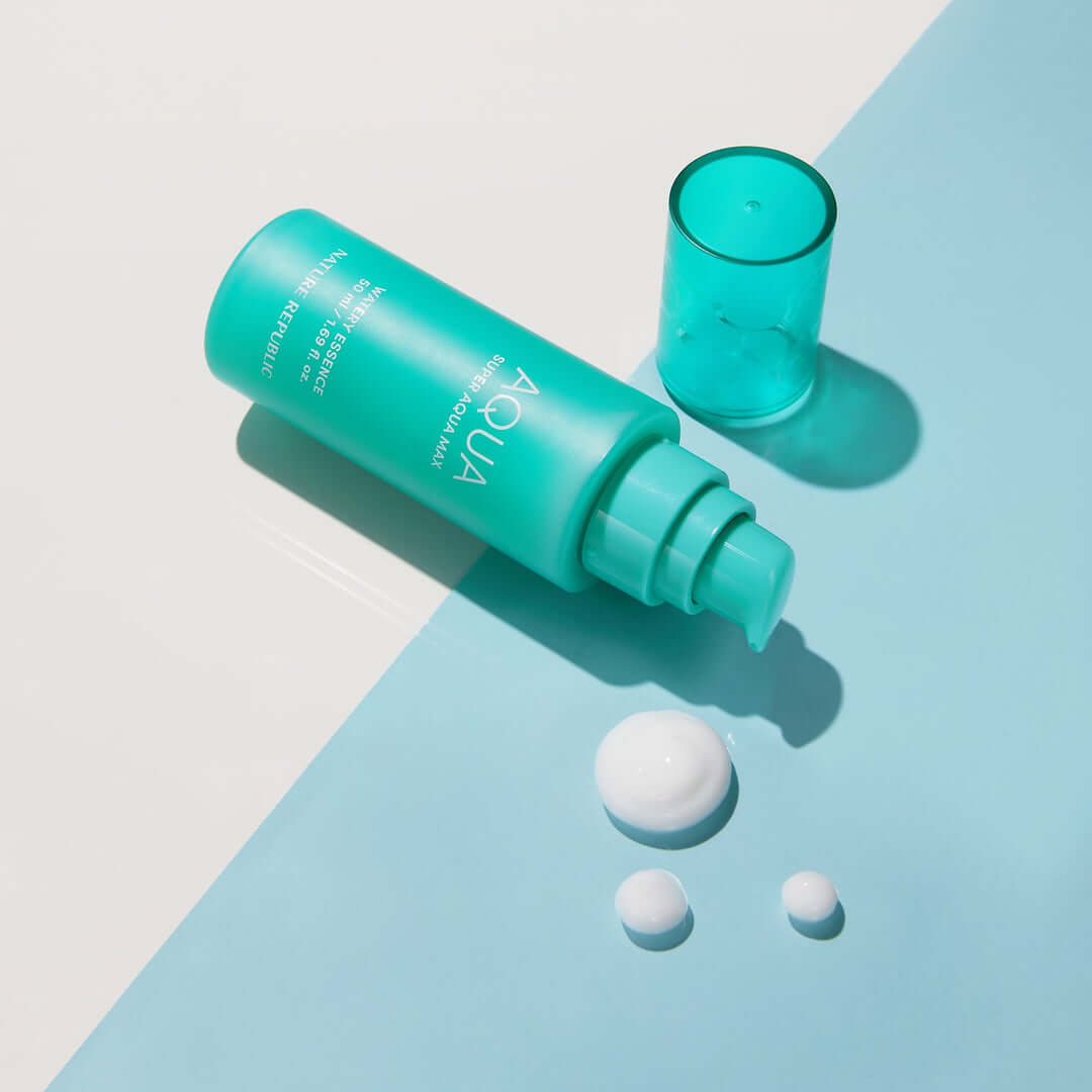 NATURE REPUBLIC Super Aqua Max Moisture Essece 50ml product with cap and droplets on blue background