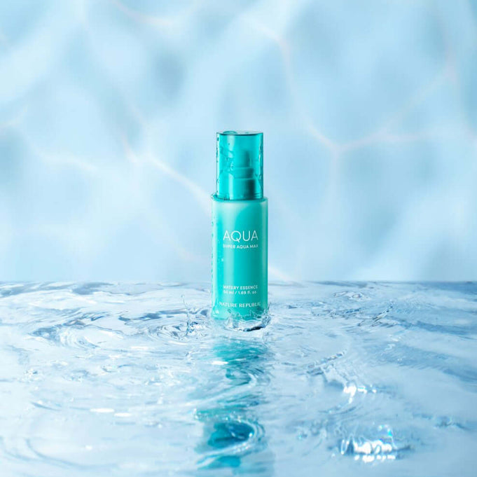 NATURE REPUBLIC Super Aqua Max Moisture Essece 50ml, hydrating essence bottle on water surface, blue backdrop