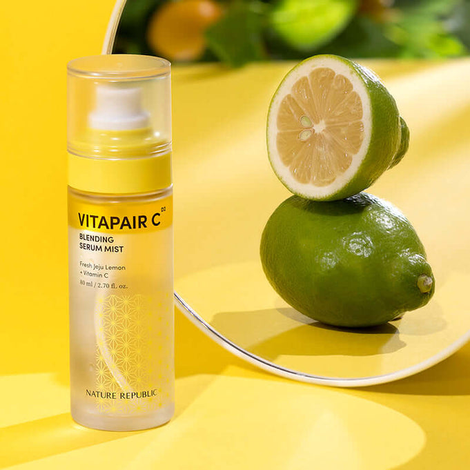 NATURE REPUBLIC Vitapair C Blending Serum Mist 80ml with citrus backdrop highlighting vitamin C ingredients.
