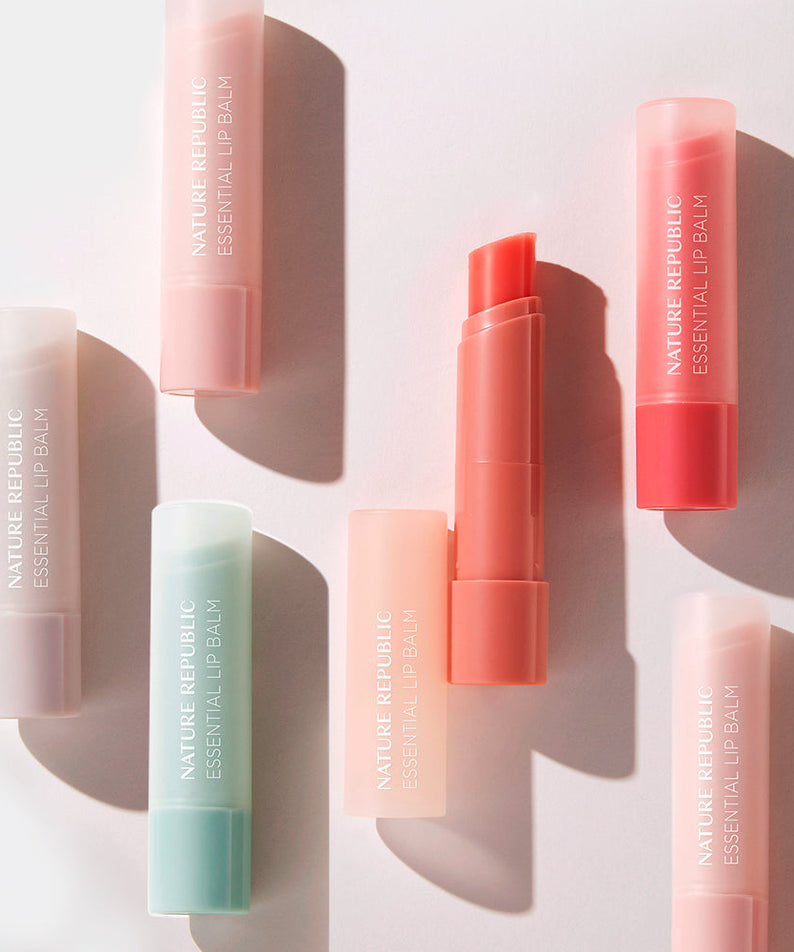 NATURE REPUBLIC Essentail Lip Balm collection showcasing various shades and packaging on a light background.
