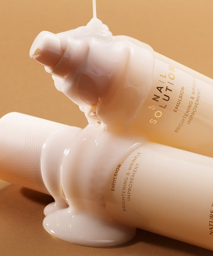 NATURE REPUBLIC Snail Solution Emulsion 120ml bottle with product pouring out for skin brightening and wrinkle improvement.