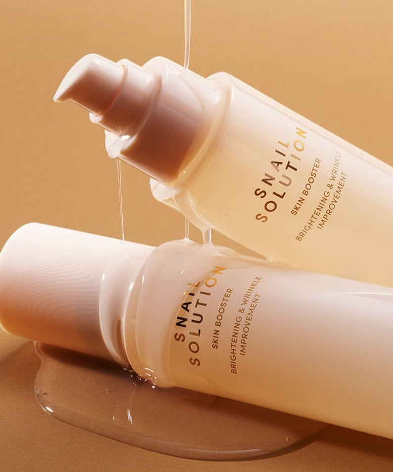 NATURE REPUBLIC Snail Solution Skin Booster 130ml – Gentleman Korea product shot with two pump bottles and snail serum glistening