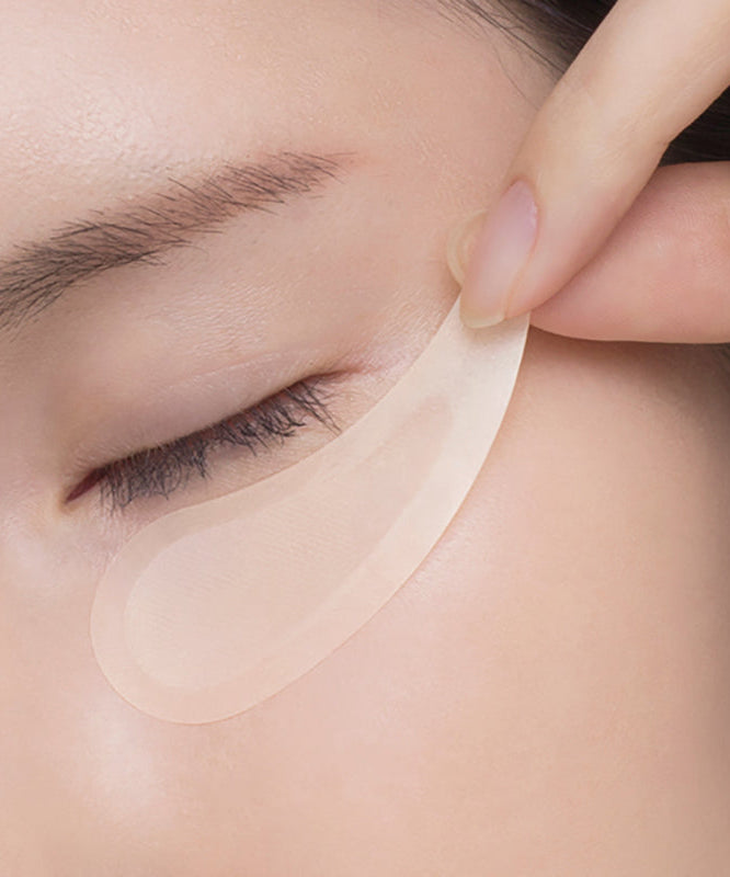 Woman applying NEEDLY Eye Patch for skincare treatment