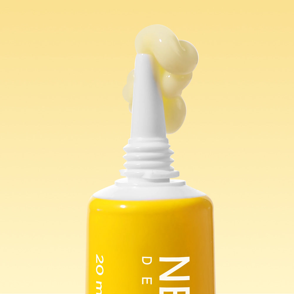 NEOGEN Next Clear Eye Cream 20ml tube with cream on nozzle against yellow background