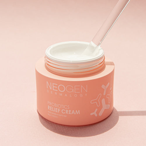 Open jar of NEOGEN Probiotics Relief Cream 50g on a pink background