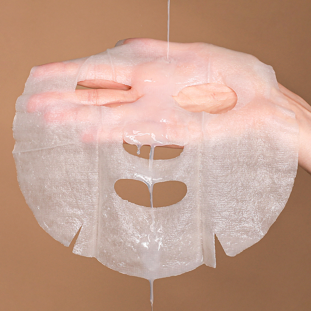 NEOGEN Real Heartleaf Soothing Mask 5 Packs being shown by hand to display its texture and quality.