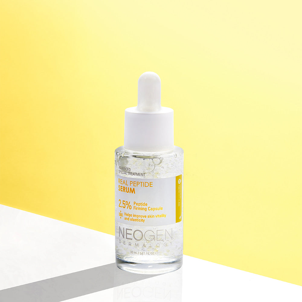 NEOGEN Real Peptide Serum 30ml, anti-aging skincare serum with peptides, on a bright yellow and white background