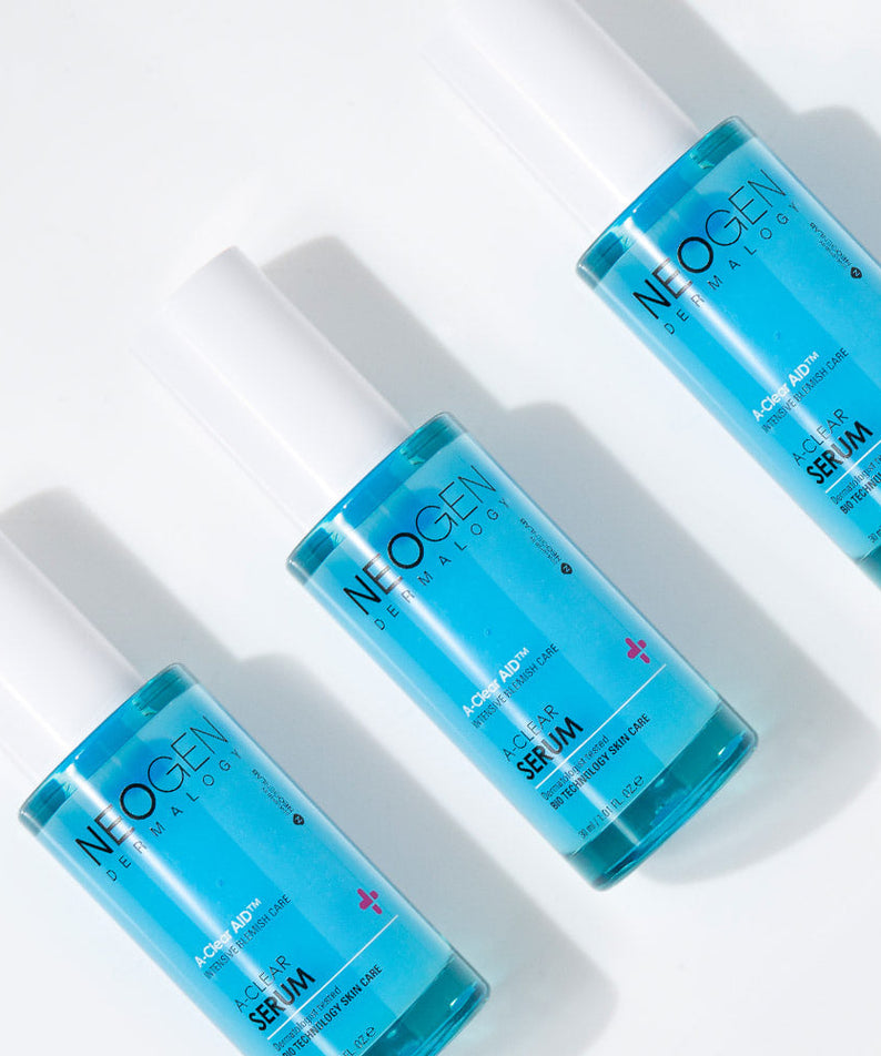 NEOGEN A Clear Serum 30ml bottles arranged in a row, showcasing the product's packaging and size.