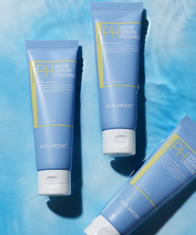 Three blue tubes of NEOGEN Azulene Soothing Midly Acidic Cleanser 150ml placed on a blue surface.