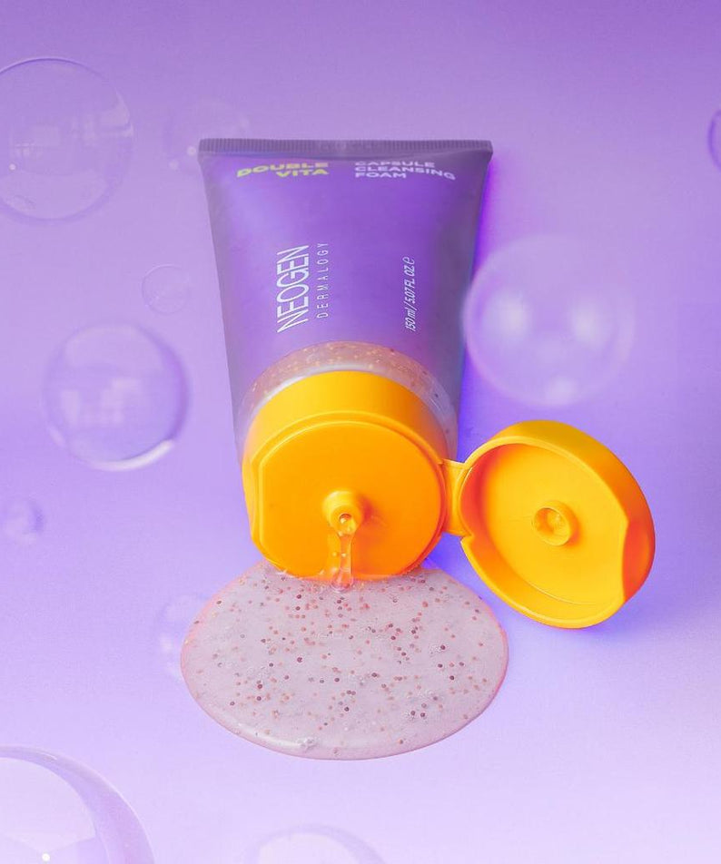 NEOGEN Dounble Viita Capsual Cleansing Foam 150ml spilling on a purple background