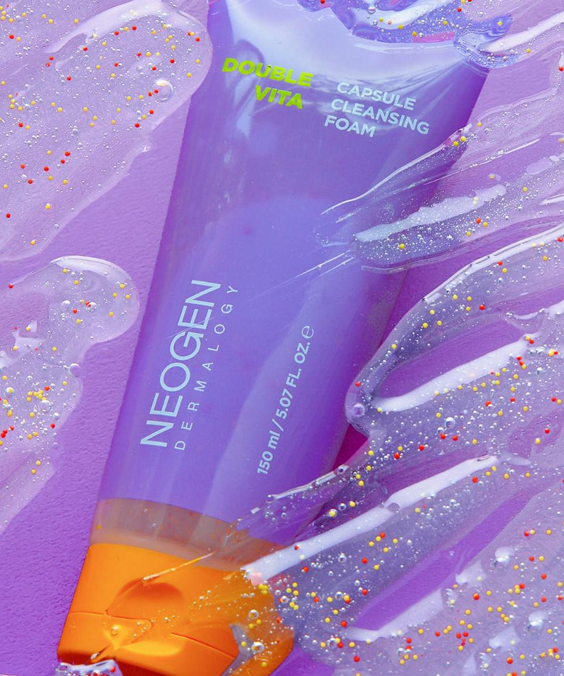 NEOGEN Dounble Viita Capsual Cleansing Foam 150ml purple tube on textured background