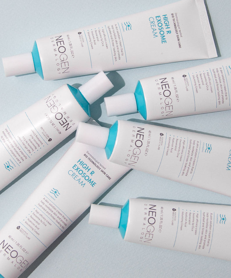Six tubes of NEOGEN Hyal Exosome Cream 40ml arranged on a flat surface, highlighting skincare packaging.