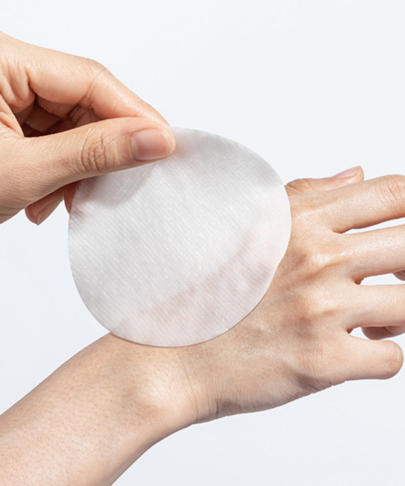 Using NEOGEN Niacinamide Glow Up Daily Mask Pads 40 Sheets on skin for a glowing complexion.