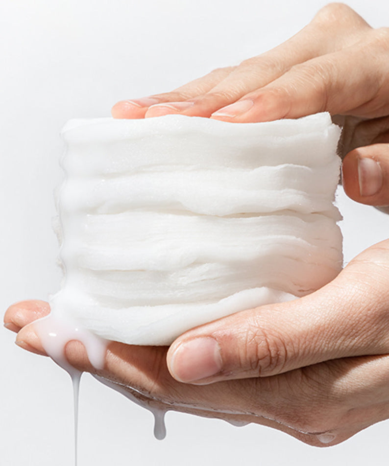 Person holding NEOGEN Niacinamide Glow Up Daily Mask Pads 40 Sheets showing texture and moisturizing essence.