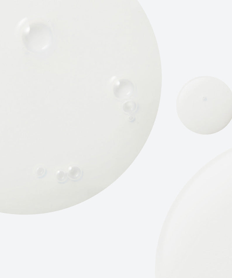 Texture of NEOGEN Real Heartleaf Soothing Essence 150ml showing clear liquid with bubbles