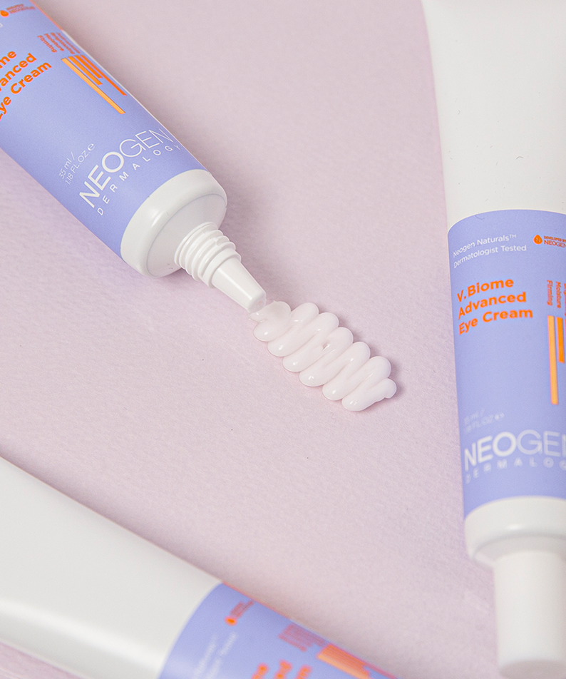 NEOGEN V Biome Advanced Eye Cream 35ml tubes arranged on a pastel background, highlighting skincare texture and packaging details.