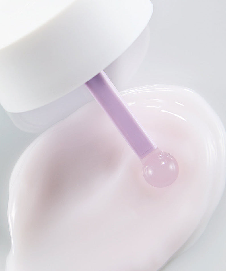 Close-up view of NEOGEN V Biome Soothing Cream 60g with a lavender applicator and cream texture on white background.