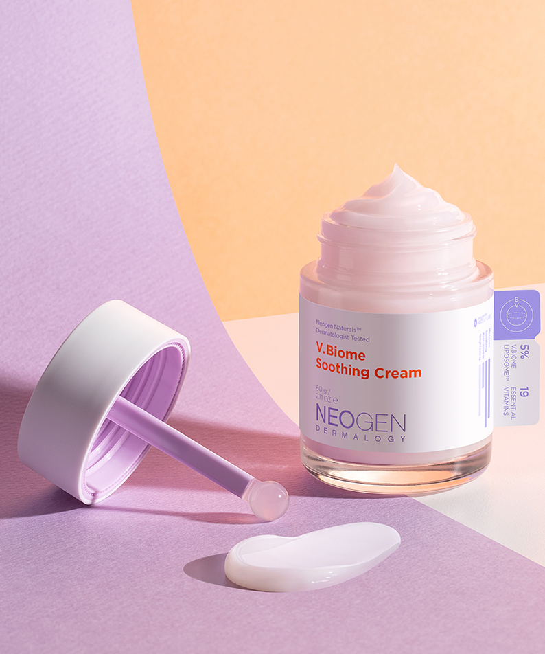NEOGEN V Biome Soothing Cream 60g in open jar with purple scoop on a pastel background.