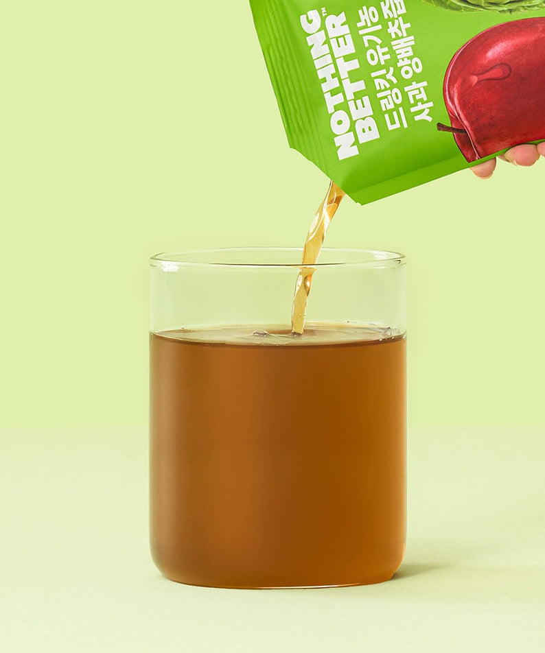 NOTHING BETTER Drinkit Organic Applr Cabbage Juice 100ml 24 Packets being poured into a glass