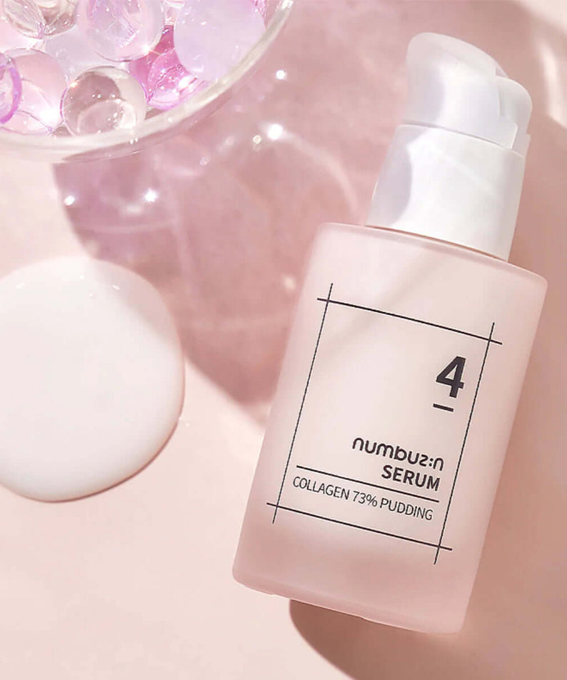 NUMBUZIN No.4 Collagen 73% Pudding Serum bottle on pink background with gel beads.